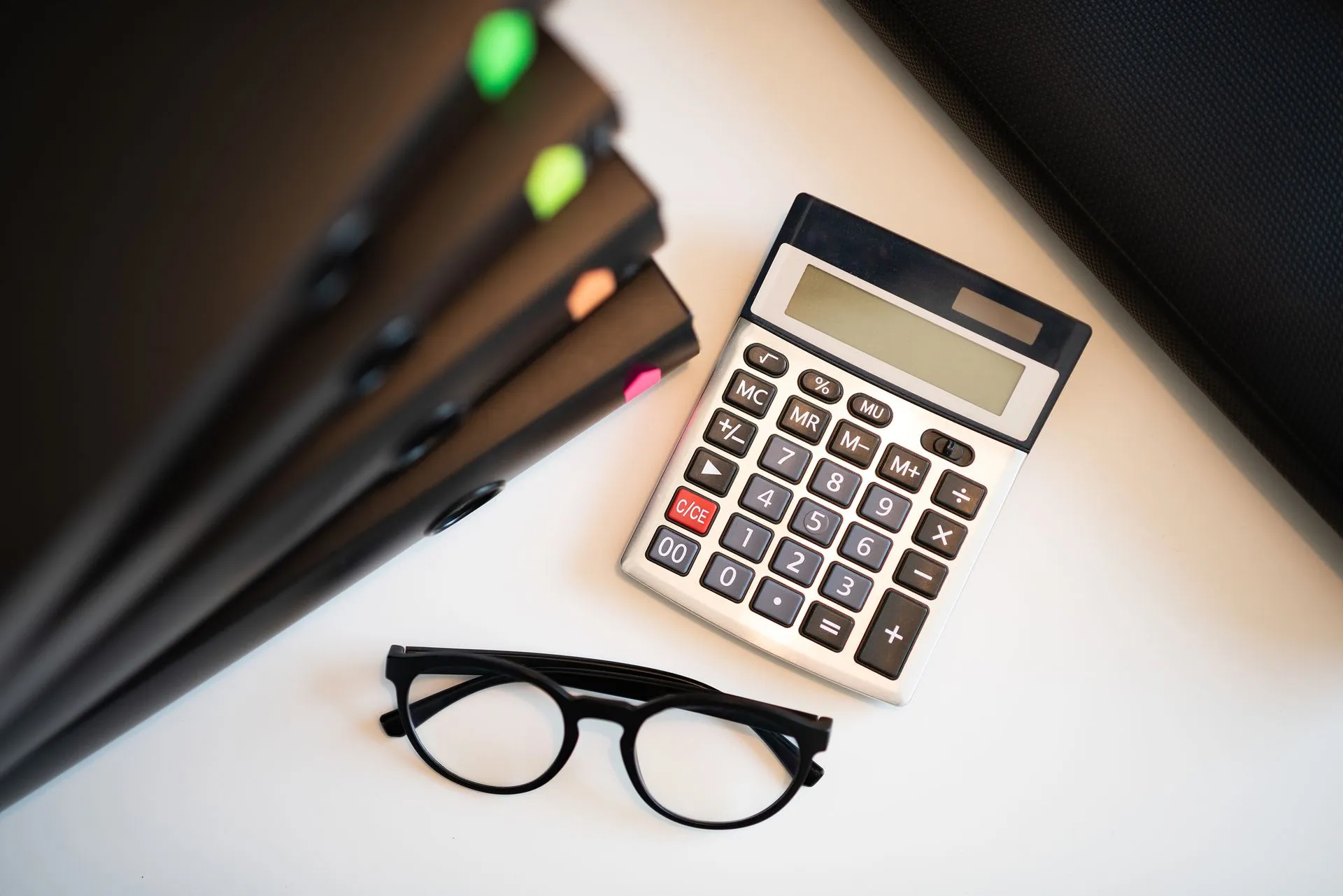Calculator glasses and folders for year-end accounts E P Accountants Worcestershire