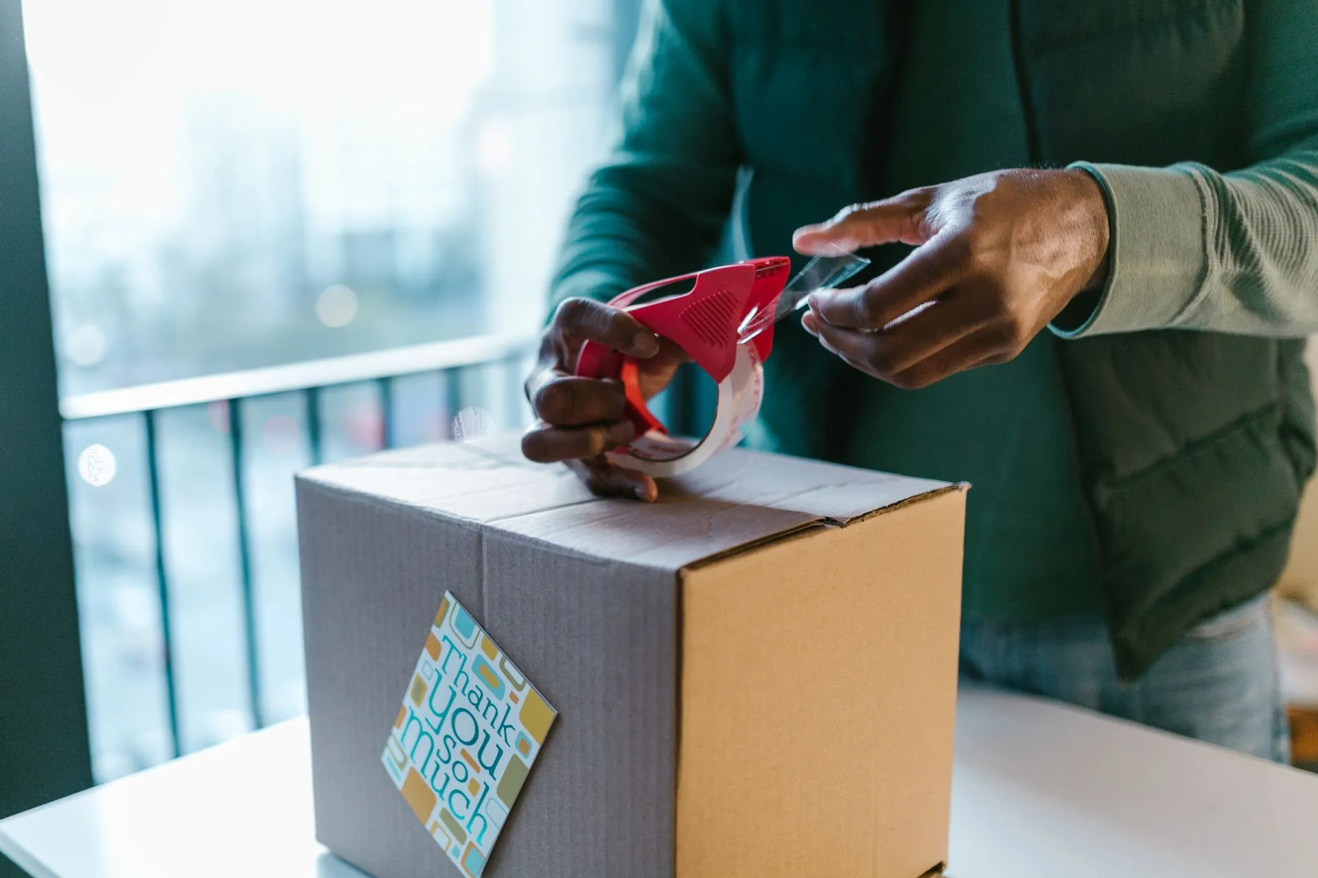 Parcel being sealed for an online order E P Accountants e-commerce accounting